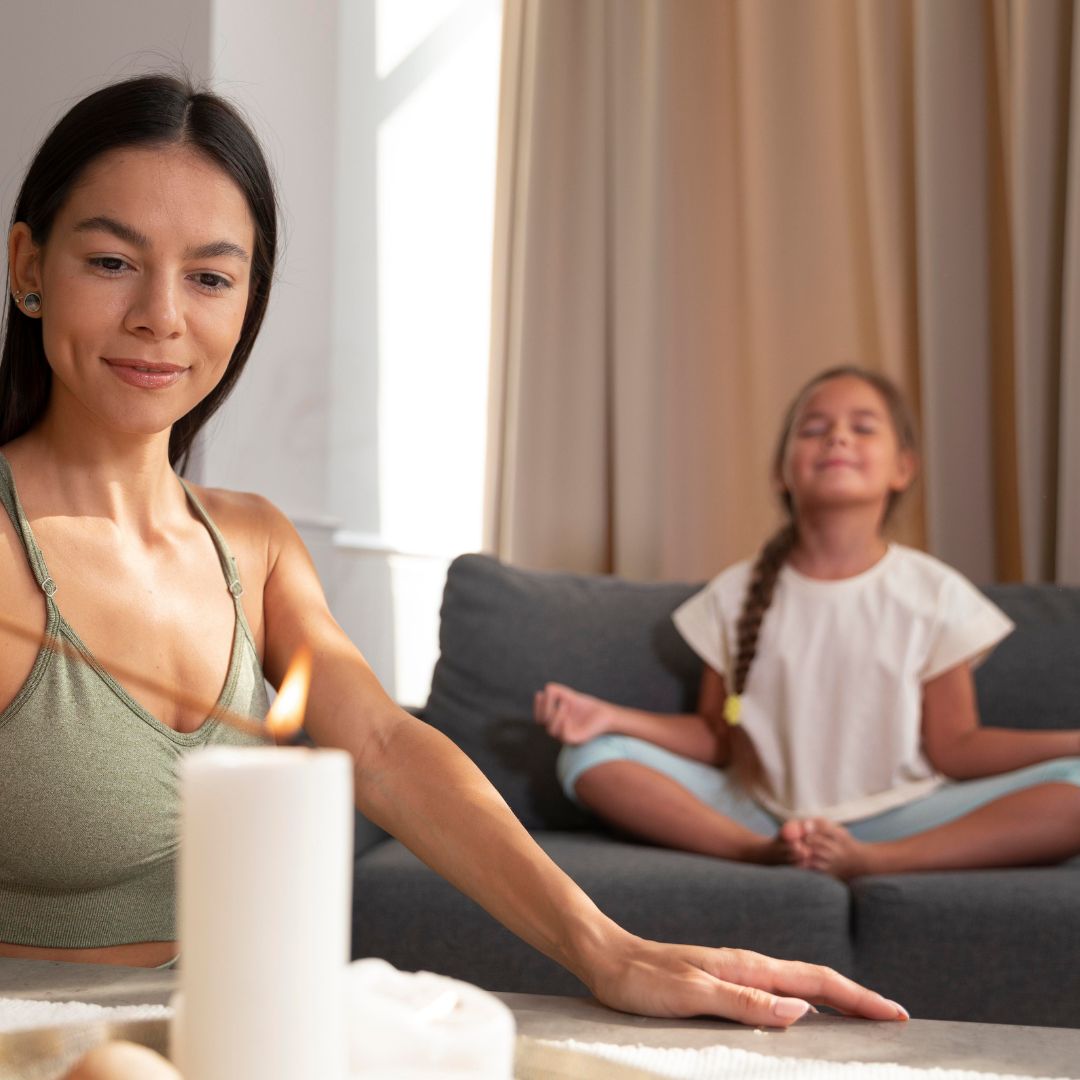 Woman with candle in serene living room, highlighting postpartum insomnia theme