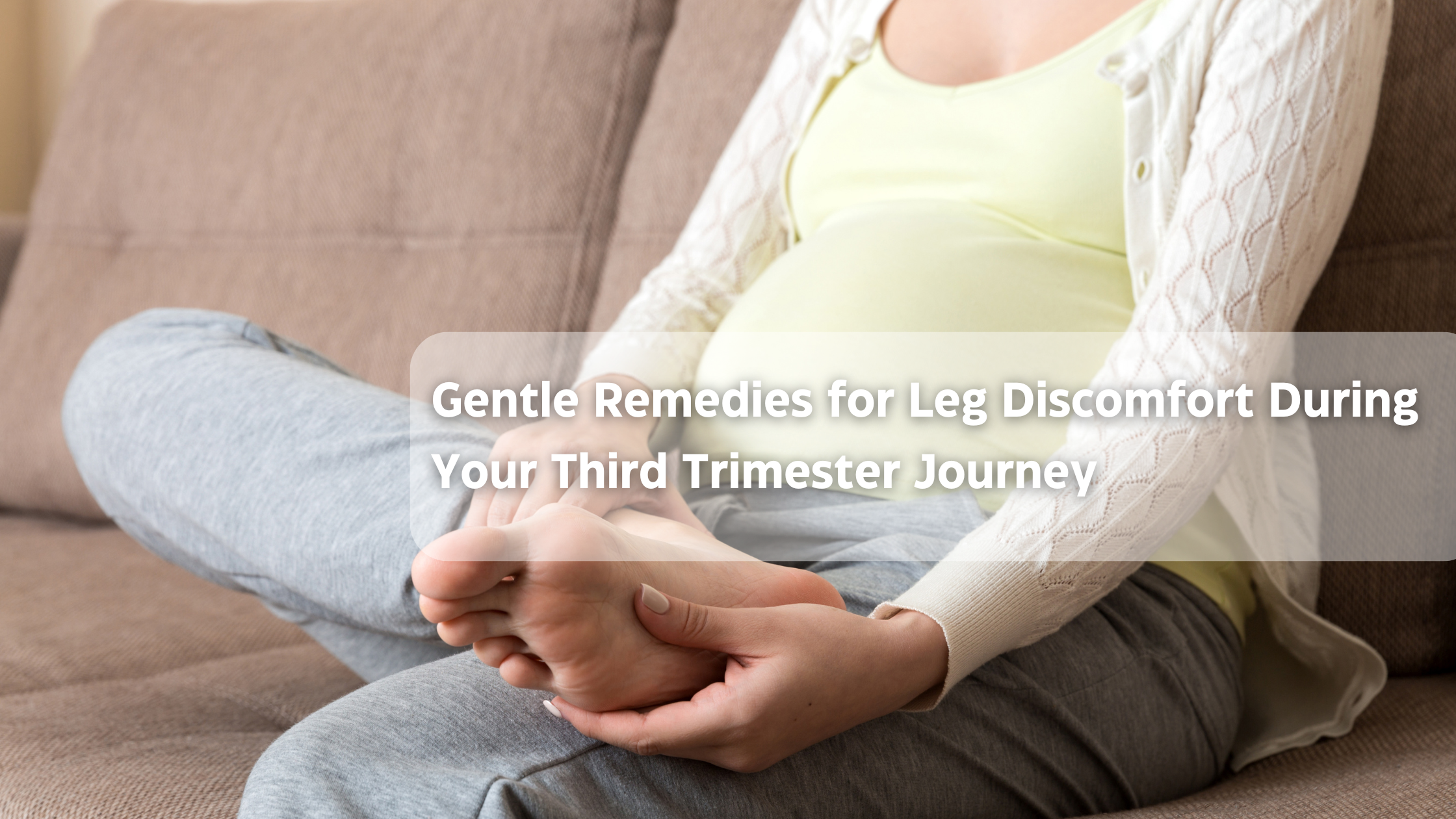 Pregnant woman relaxing on a couch with smartphone, easing third-trimester leg discomfort.