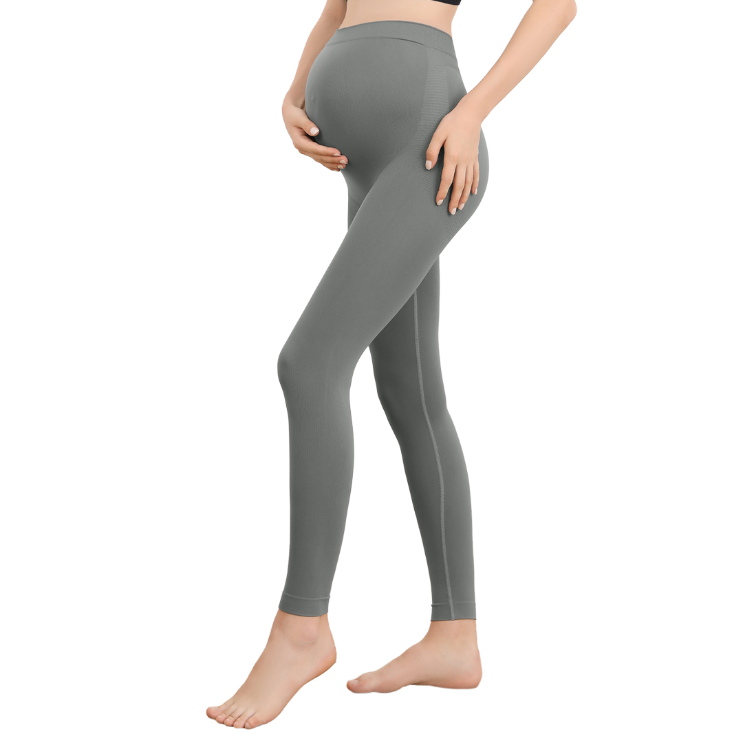 Gray leggings maternity gift with movement-ready stance against white background