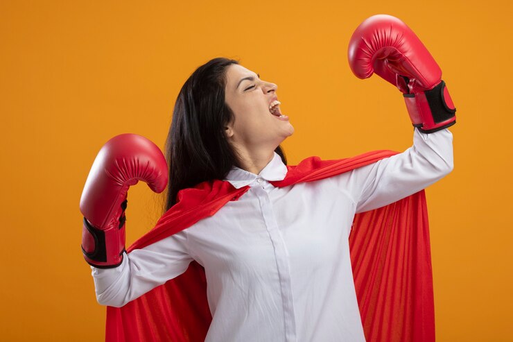 Woman in superhero attire celebrating empowerment, symbolizing breastfeeding triumph