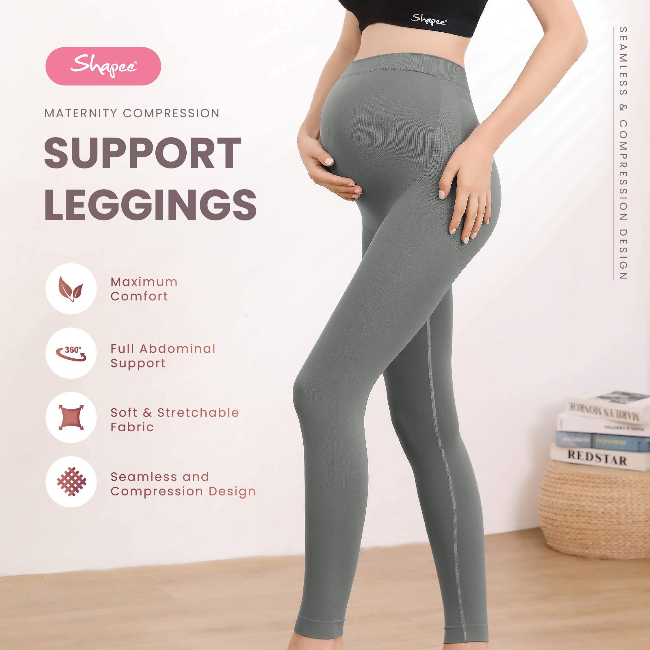 Pregnant woman wearing gray maternity shapewear leggings with full support.