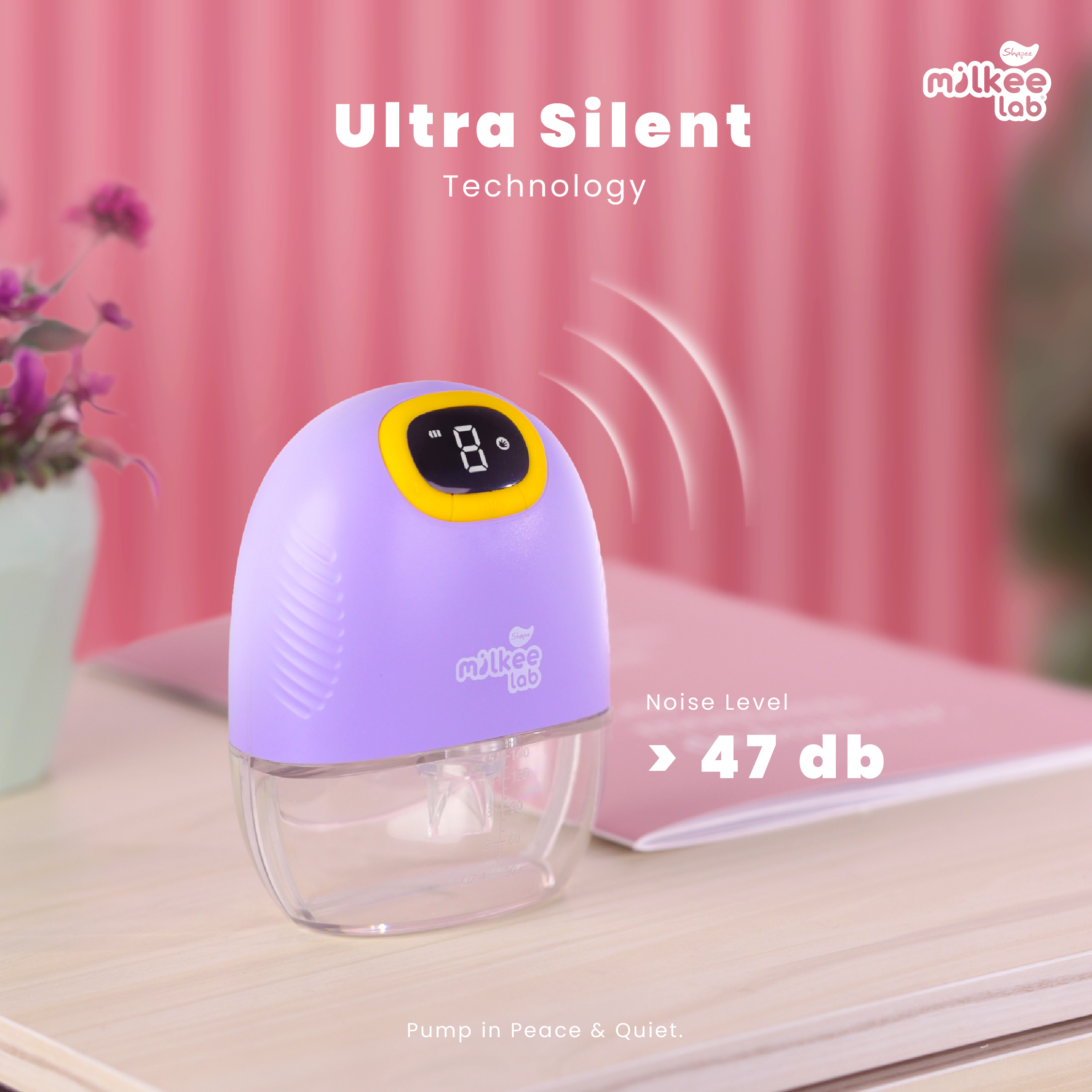 Milk Lab Ultra Silent Technology Hands-Free Breast Pump on wooden surface