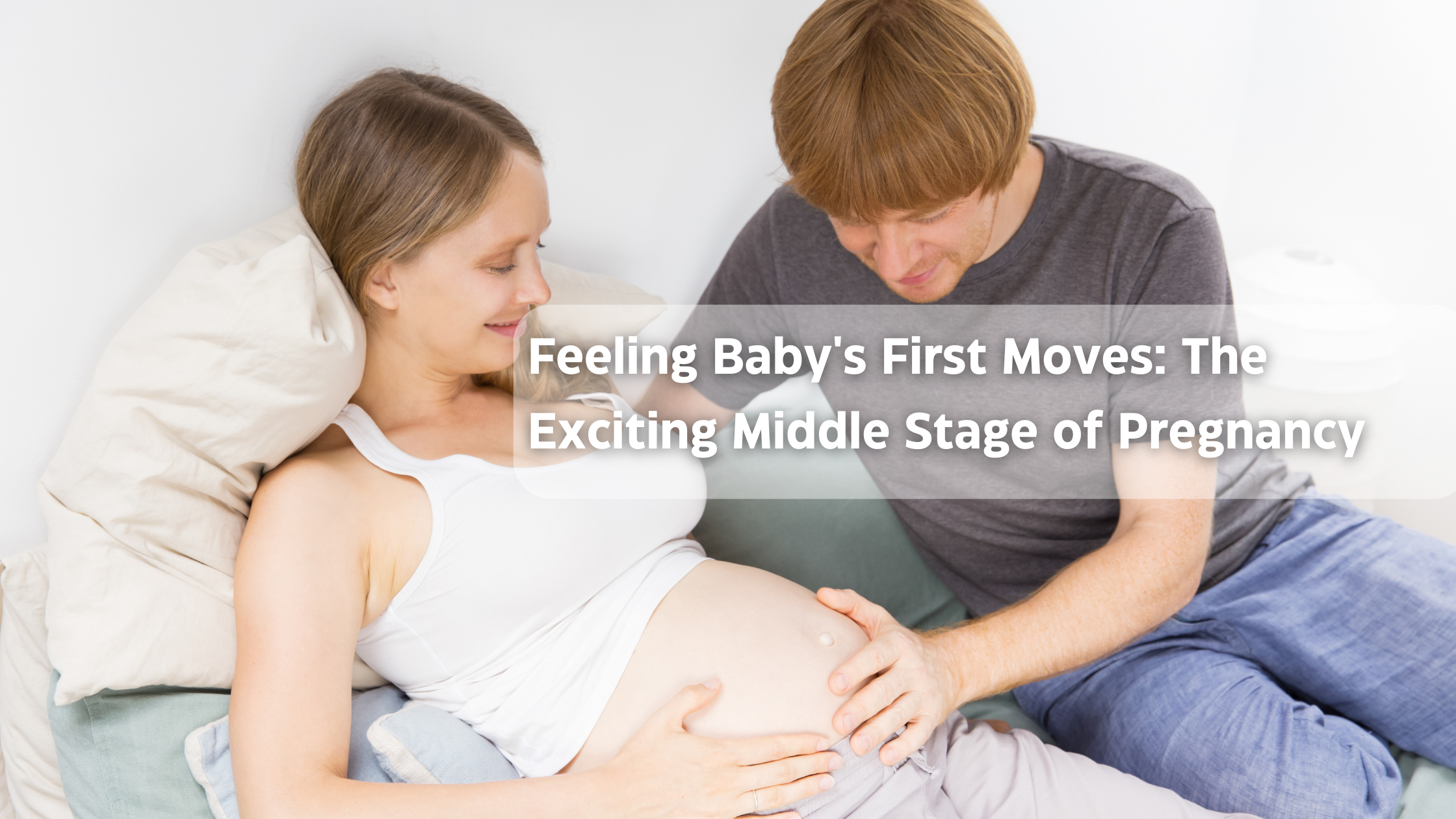 Pregnant woman and partner enjoy feeling baby's movements in the second trimester.