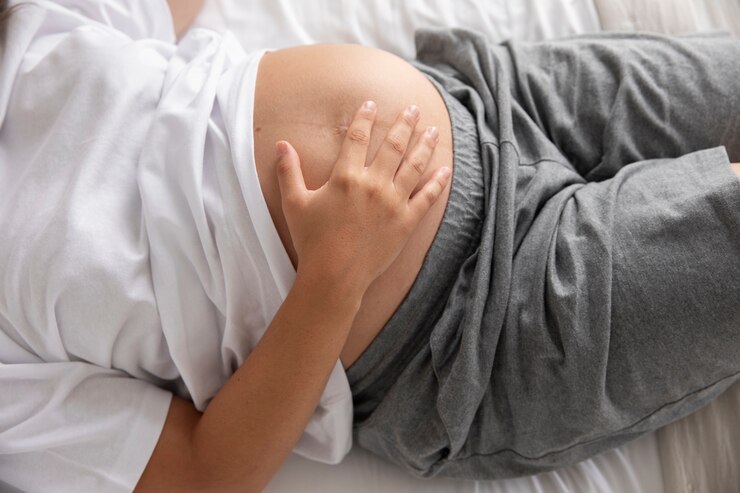 Pregnancy belly touch, focus on Vitamin C benefits during pregnancy