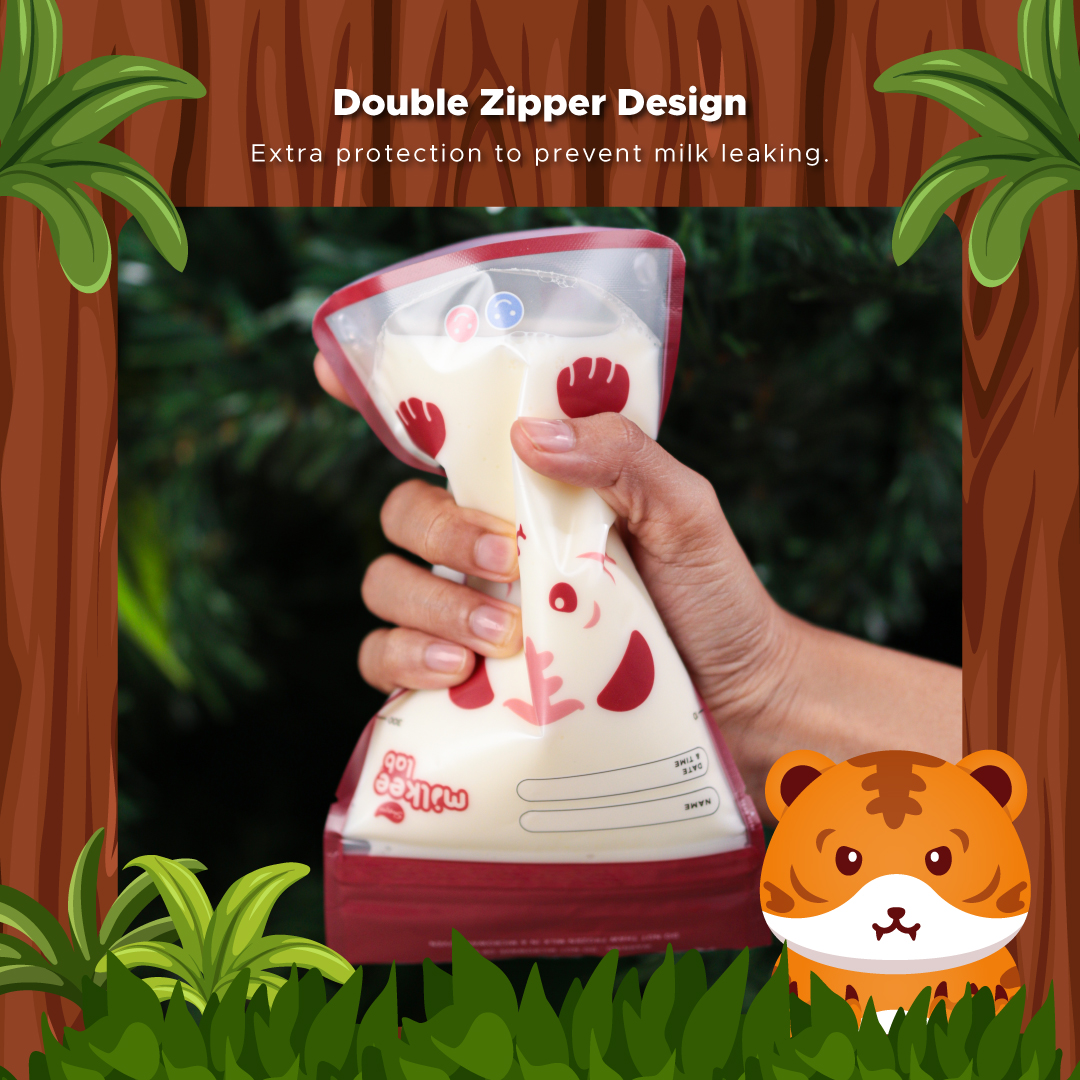 Hand holding Smart Milk Storage bag with cartoon tiger in natural setting