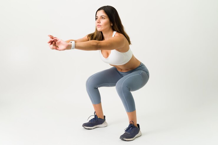 Woman performing squat exercise for pelvic floor therapy guidance